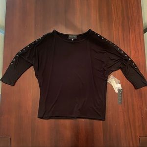 Fabulous black stretch Dolman top with sleeve button detailing. NWT.